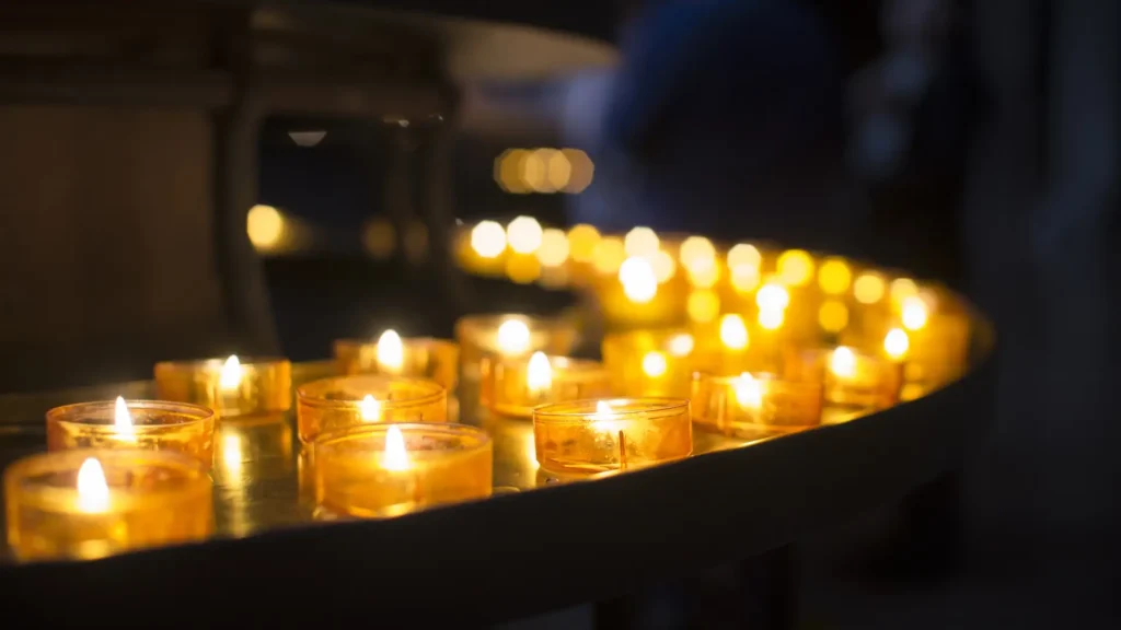 image of candles at a catholic funeral