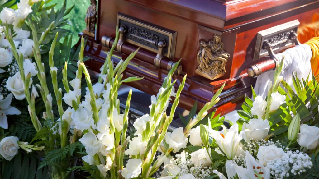 a casket at a catholic funeral