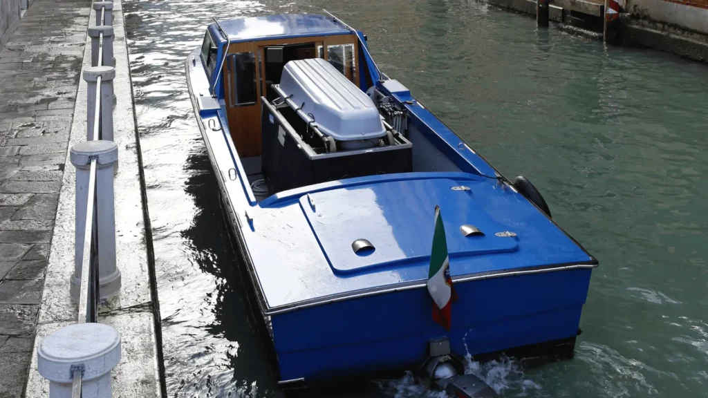 a casket heading to a funeral by boat in italy